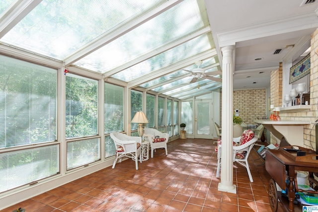 sunroom / solarium featuring a ceiling fan and visible vents