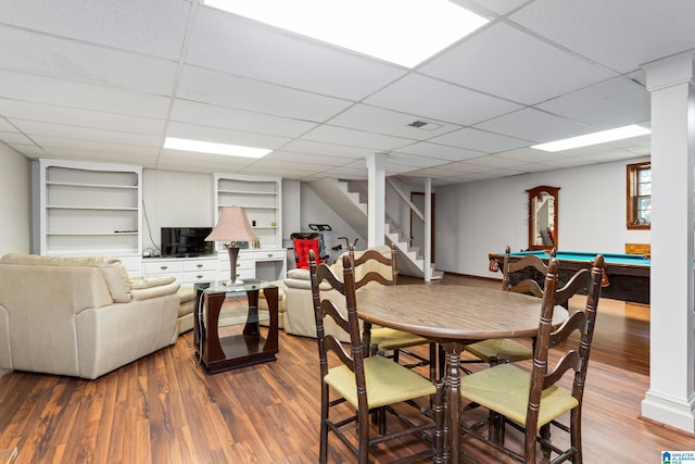 dining space with wood finished floors, pool table, visible vents, and stairs