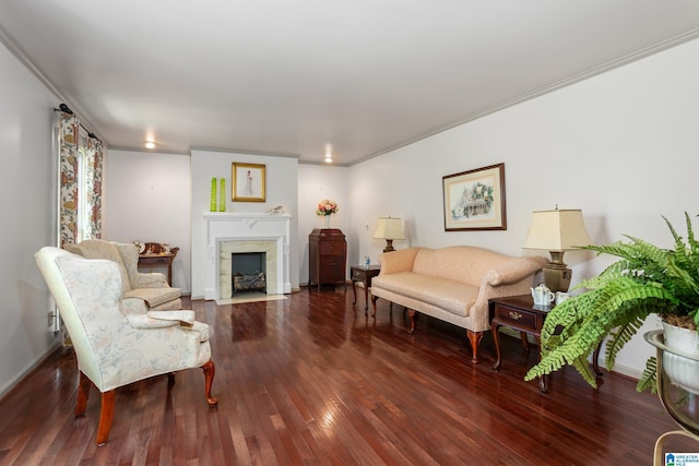 living room with crown molding, baseboards, a high end fireplace, and dark wood finished floors