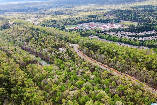 drone / aerial view featuring a view of trees