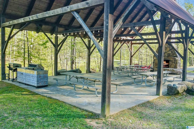 view of community with a yard and a patio