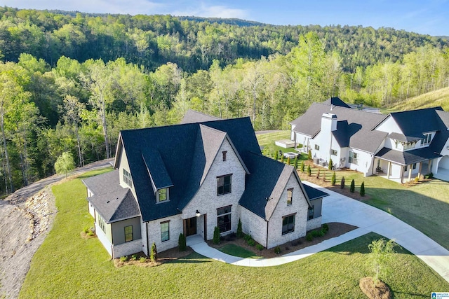 bird's eye view featuring a forest view