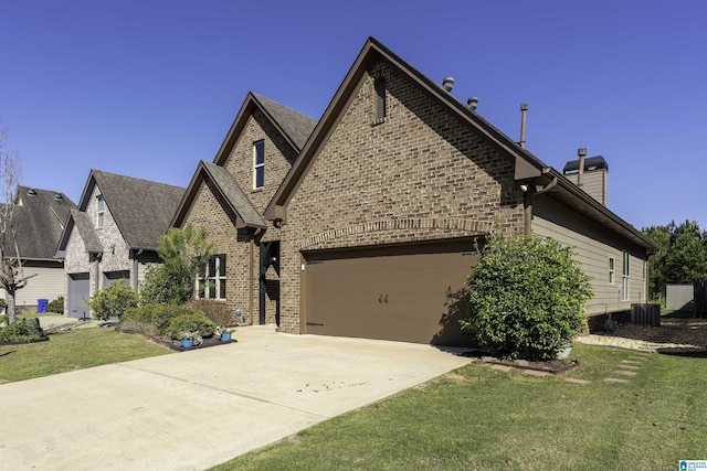 view of front facade with driveway, brick siding, a front yard, and central air condition unit