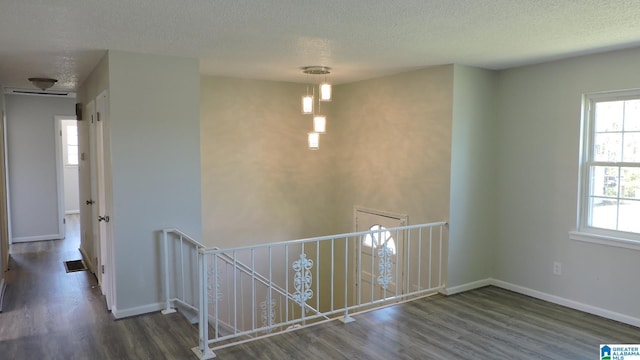 987 Chichester Dr, Birmingham, AL 35214 - corridor with an upstairs landing, a textured ceiling, and wood finished floors