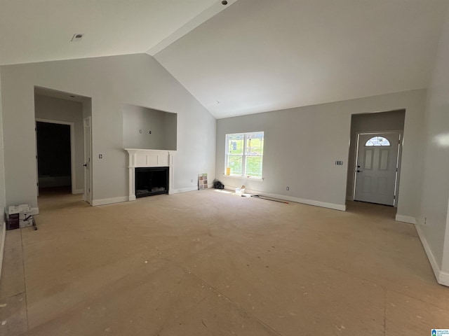 unfurnished living room with baseboards, high vaulted ceiling, and a fireplace