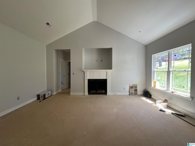 unfurnished living room featuring baseboards, high vaulted ceiling, a fireplace, and visible vents