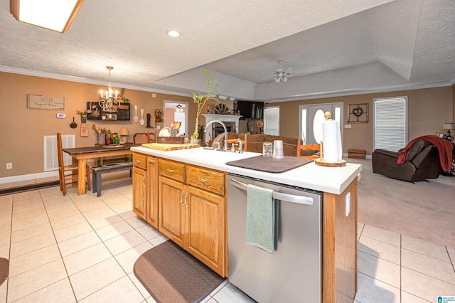 kitchen featuring visible vents, open floor plan, a textured ceiling, stainless steel dishwasher, and light tile patterned flooring