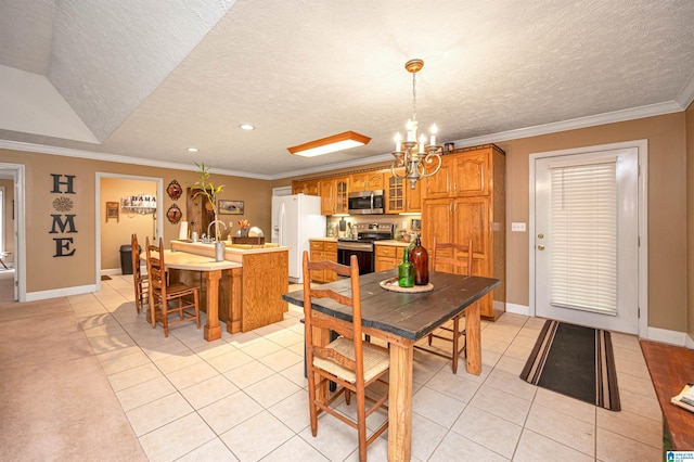 dining space featuring a chandelier, a textured ceiling, and light tile patterned flooring