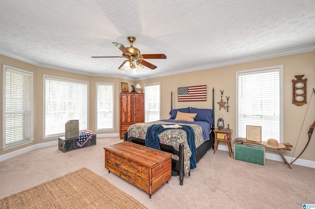 bedroom featuring multiple windows, light colored carpet, crown molding, and a textured ceiling