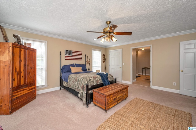 bedroom featuring crown molding, ceiling fan, a textured ceiling, light colored carpet, and baseboards