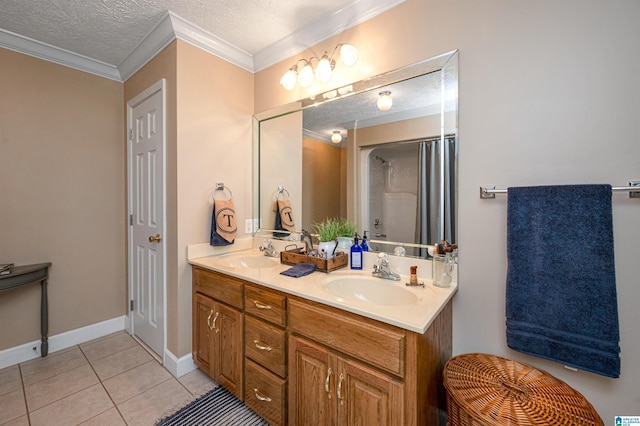 full bath featuring tile patterned flooring, a textured ceiling, a sink, and ornamental molding