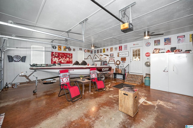 garage with a garage door opener and a ceiling fan