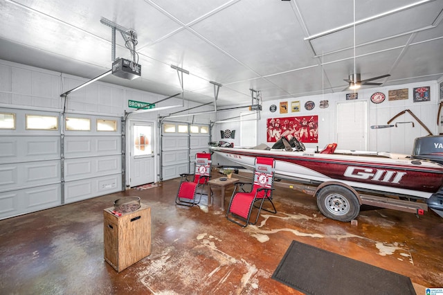 garage featuring a garage door opener and a ceiling fan