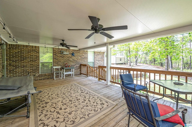 wooden terrace with ceiling fan