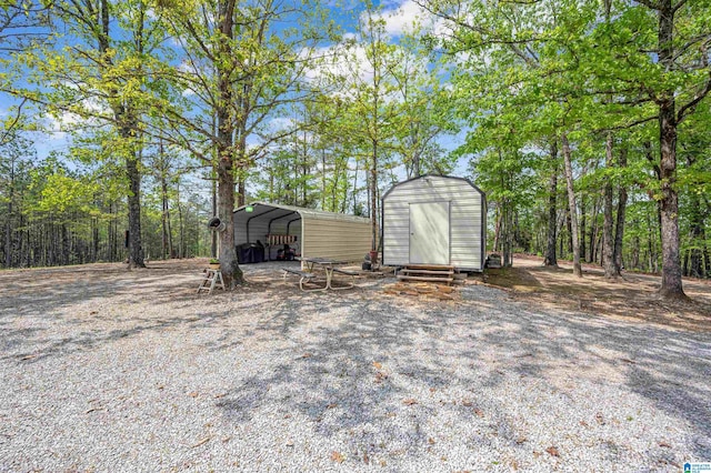 view of shed with a carport