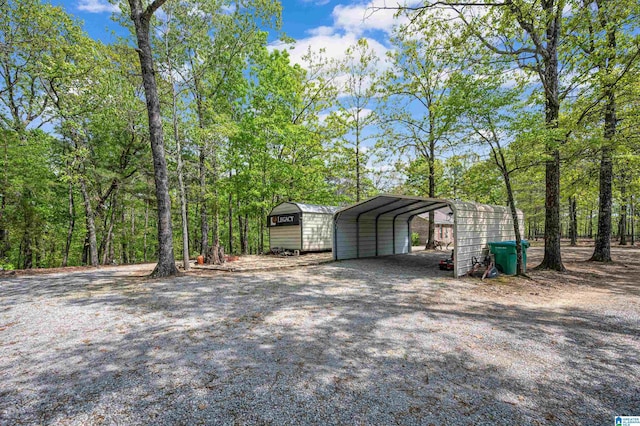 exterior space with a carport and dirt driveway