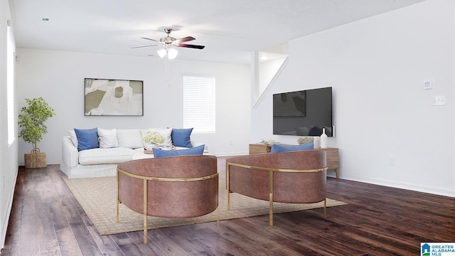 living area featuring ceiling fan, wood finished floors, and baseboards