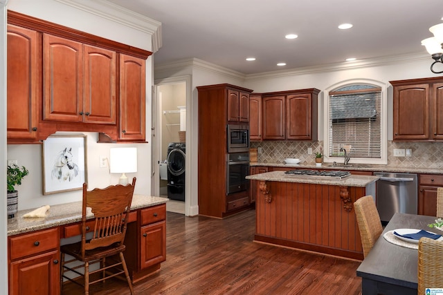 kitchen featuring a sink, appliances with stainless steel finishes, dark wood-style floors, backsplash, and light stone counters