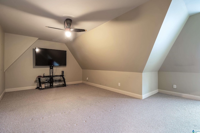 bonus room featuring baseboards, carpet floors, a ceiling fan, and lofted ceiling