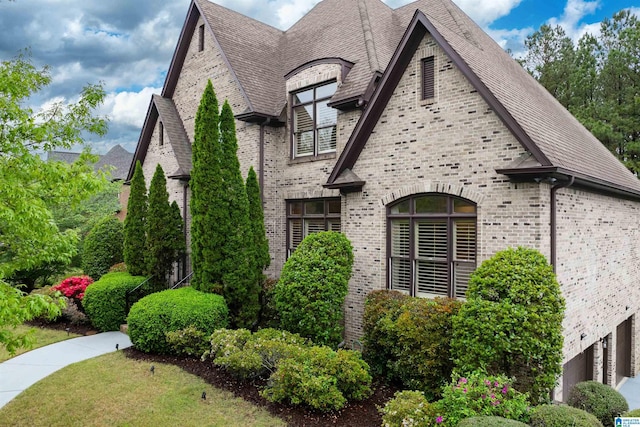 view of property exterior featuring brick siding