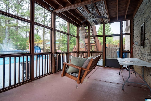 sunroom with a wealth of natural light and a ceiling fan
