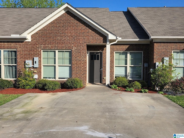 6106 Townley Ct, Mccalla, AL 35111 - view of front facade with brick siding and a shingled roof