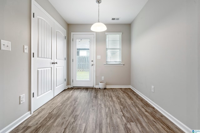 6106 Townley Ct, Mccalla, AL 35111 - doorway to outside featuring visible vents, baseboards, and wood finished floors