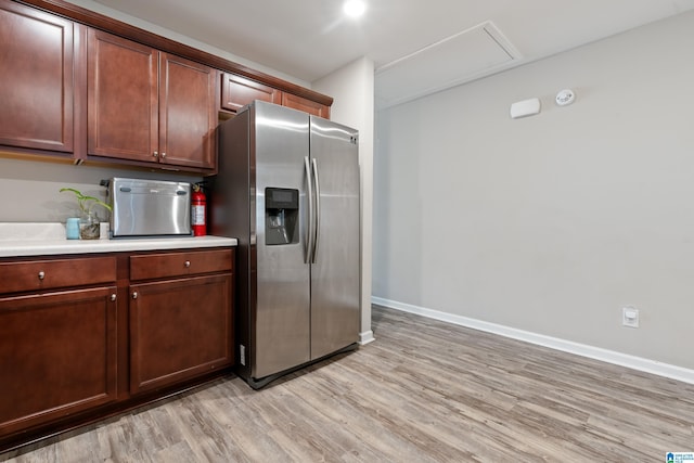 6106 Townley Ct, Mccalla, AL 35111 - kitchen with light countertops, stainless steel refrigerator with ice dispenser, light wood-type flooring, and baseboards