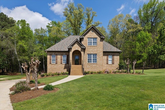 88 Glen Trce, Springville, AL 35146 - view of front of house featuring a shingled roof, a front yard, and brick siding