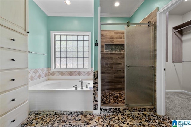 88 Glen Trce, Springville, AL 35146 - bathroom with crown molding, a shower stall, and a garden tub