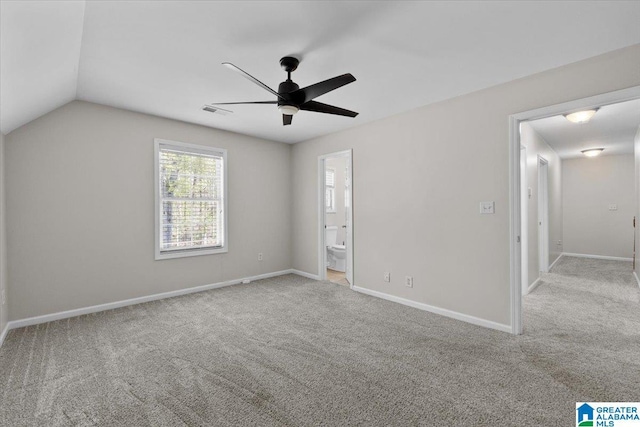 88 Glen Trce, Springville, AL 35146 - unfurnished bedroom with ensuite bath, visible vents, carpet flooring, lofted ceiling, and baseboards