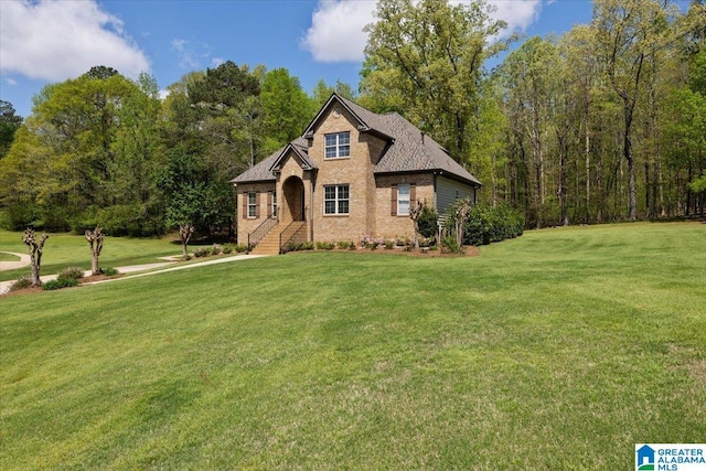 88 Glen Trce, Springville, AL 35146 - view of front facade with a shingled roof, a front lawn, and brick siding