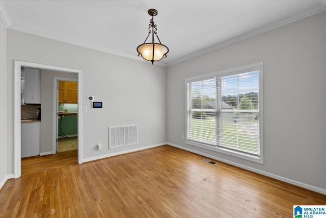 88 Glen Trce, Springville, AL 35146 - spare room with ornamental molding, visible vents, baseboards, and wood finished floors
