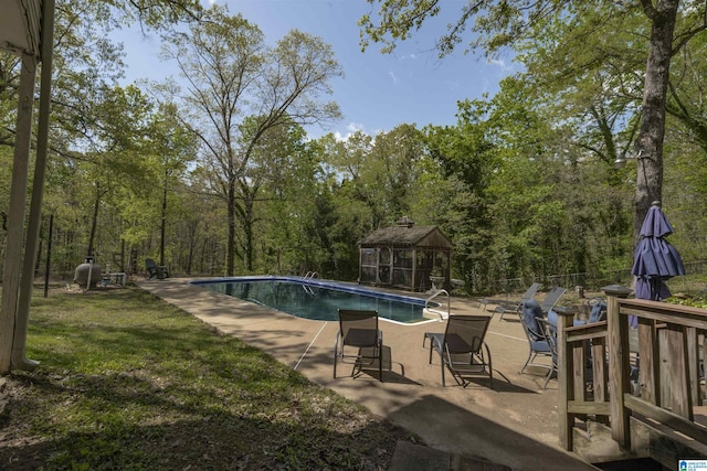 pool with a gazebo and a patio area