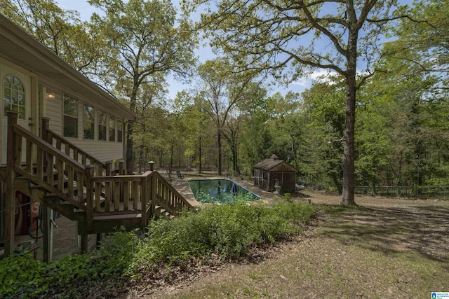 view of swimming pool with an outbuilding and stairway