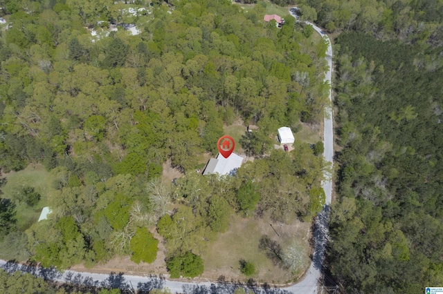 bird's eye view featuring a forest view