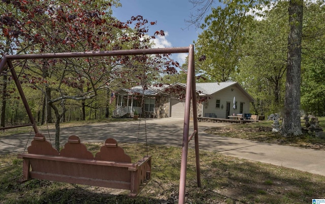 view of front of property featuring an attached garage and concrete driveway