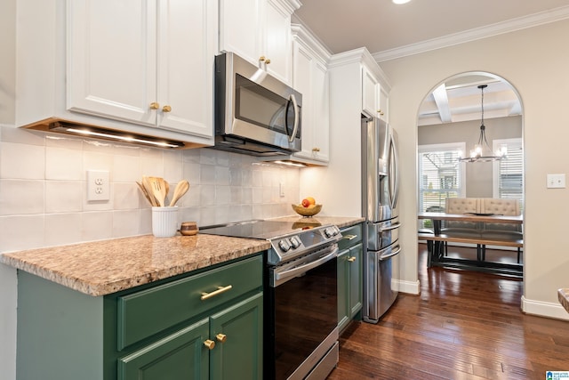 kitchen featuring green cabinetry, ornamental molding, appliances with stainless steel finishes, white cabinetry, and dark wood-type flooring