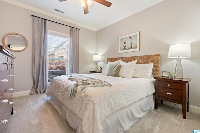 bedroom featuring visible vents, baseboards, ornamental molding, a ceiling fan, and light colored carpet