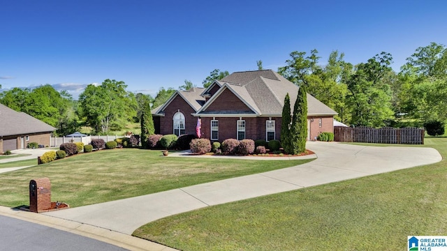 craftsman house featuring concrete driveway, fence, a front lawn, and brick siding