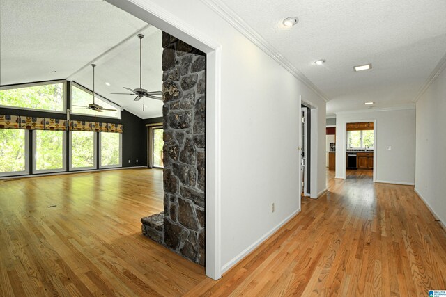 5000 Cameron Rd, Birmingham, AL 35242 - corridor featuring a textured ceiling, vaulted ceiling, baseboards, wood finished floors, and crown molding