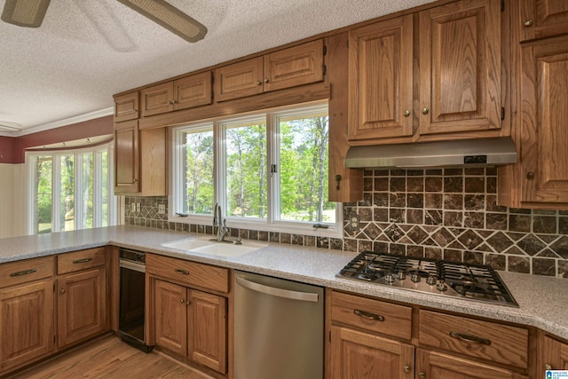 5000 Cameron Rd, Birmingham, AL 35242 - kitchen featuring ventilation hood, a sink, a textured ceiling, brown cabinetry, and appliances with stainless steel finishes