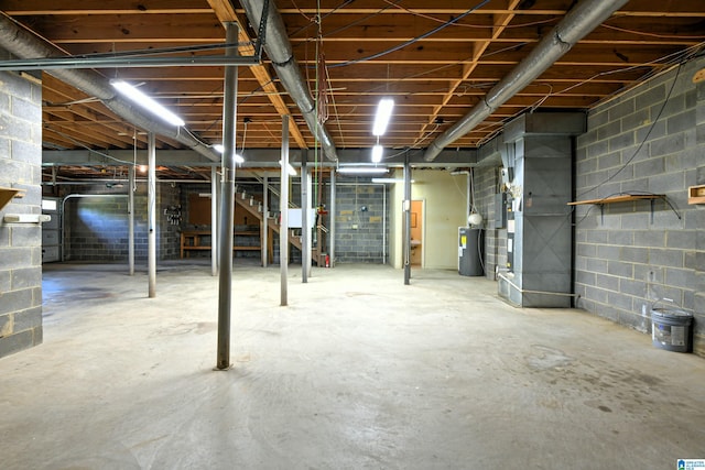 5000 Cameron Rd, Birmingham, AL 35242 - unfinished below grade area with concrete block wall, stairway, and electric water heater