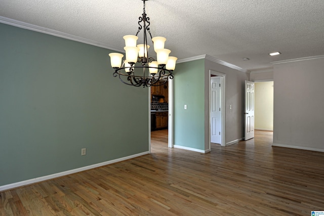 5000 Cameron Rd, Birmingham, AL 35242 - unfurnished room with wood finished floors, a textured ceiling, a notable chandelier, and crown molding