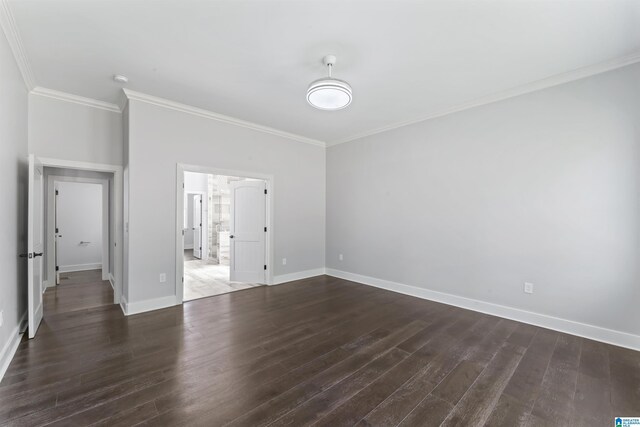 unfurnished bedroom featuring dark wood-style flooring, baseboards, and crown molding