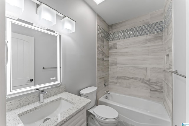 bathroom featuring toilet, vanity, and bathtub / shower combination