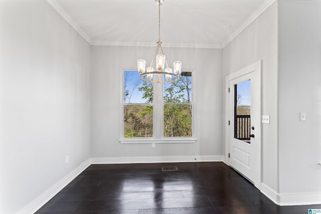 interior space with hardwood / wood-style floors, a notable chandelier, ornamental molding, and a wealth of natural light