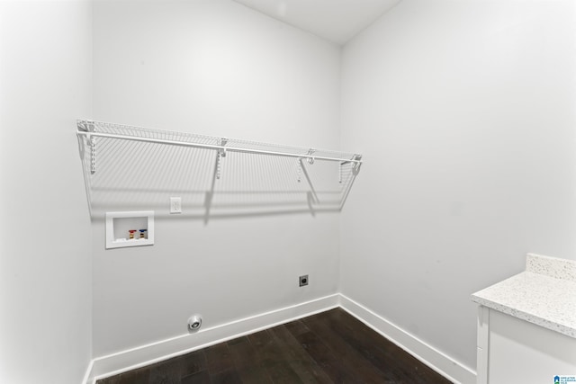 washroom with baseboards, laundry area, dark wood-style floors, hookup for an electric dryer, and hookup for a washing machine