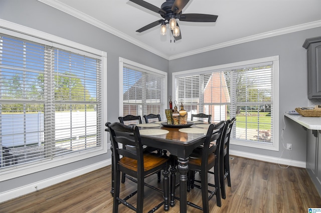 dining room with crown molding, baseboards, and dark wood-style floors