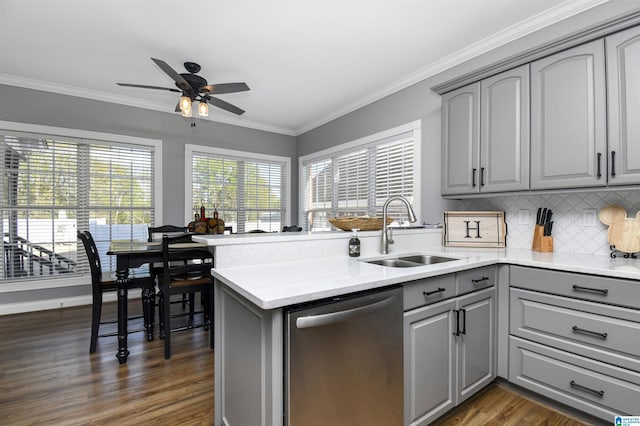 kitchen with crown molding, a ceiling fan, dishwasher, a sink, and gray cabinetry